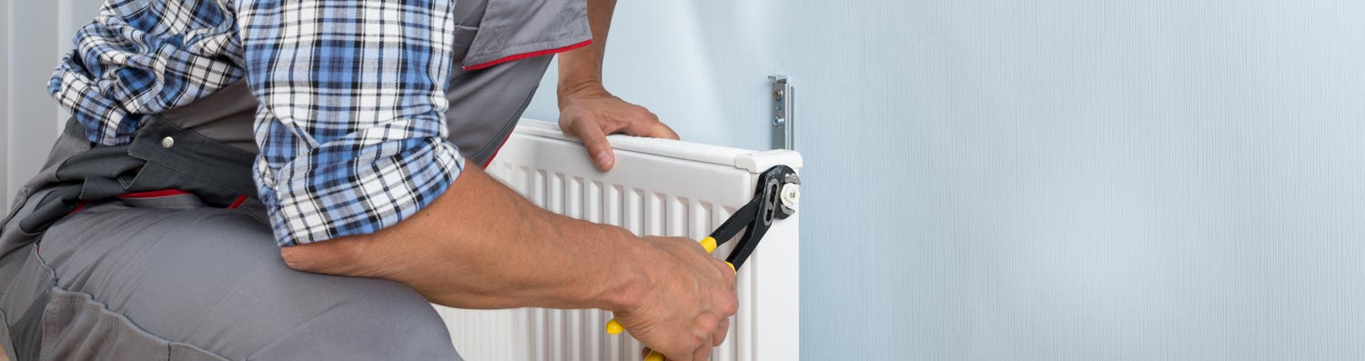 Man fixing radiator